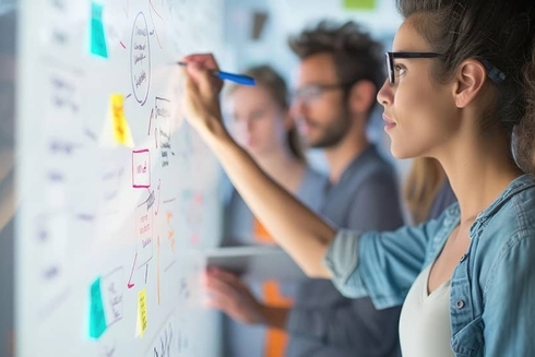 Girl drawing on a board with sticky notes - Productivity Growth - Inter American Development Bank - IDB